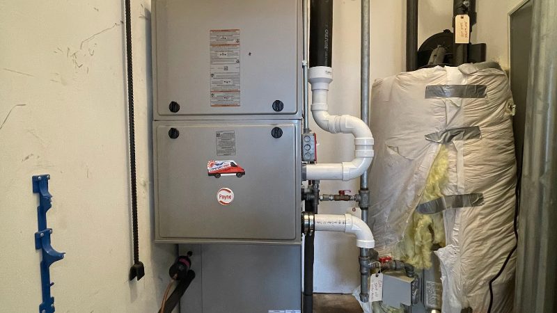 Furnace and gas piping in a utility closet during a Comfort Pro service call