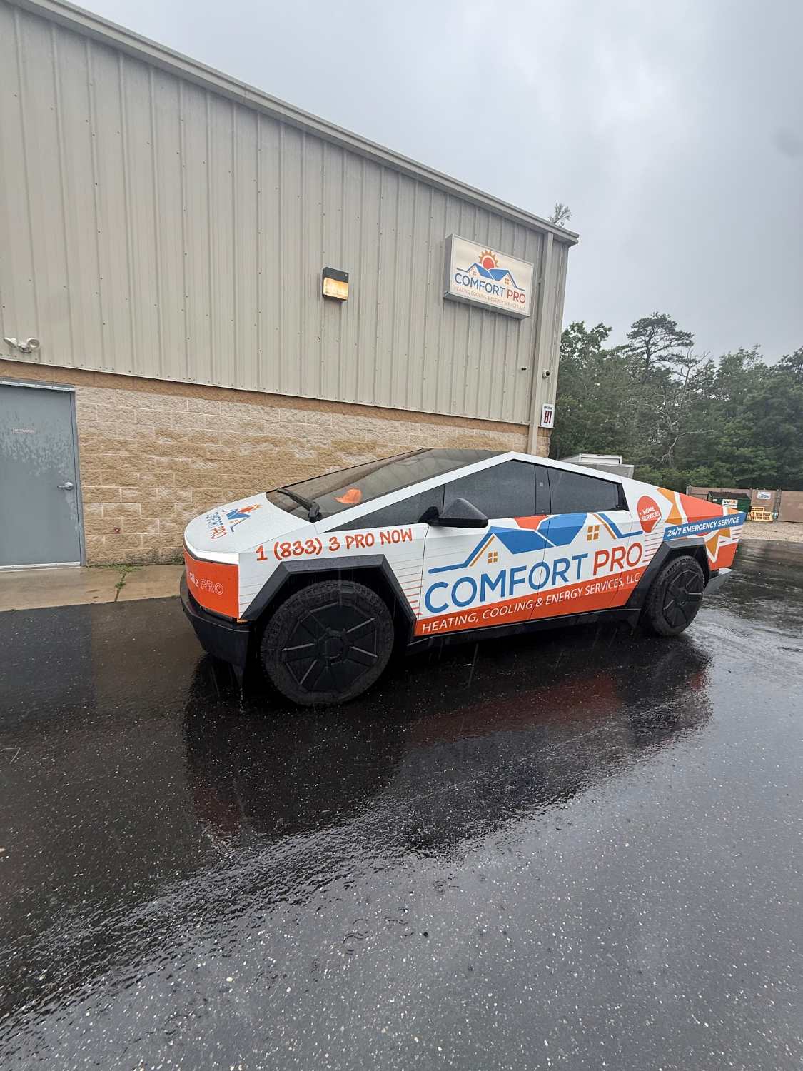 The wrapped Comfort Pro Cybertruck outside the Comfort Pro shop