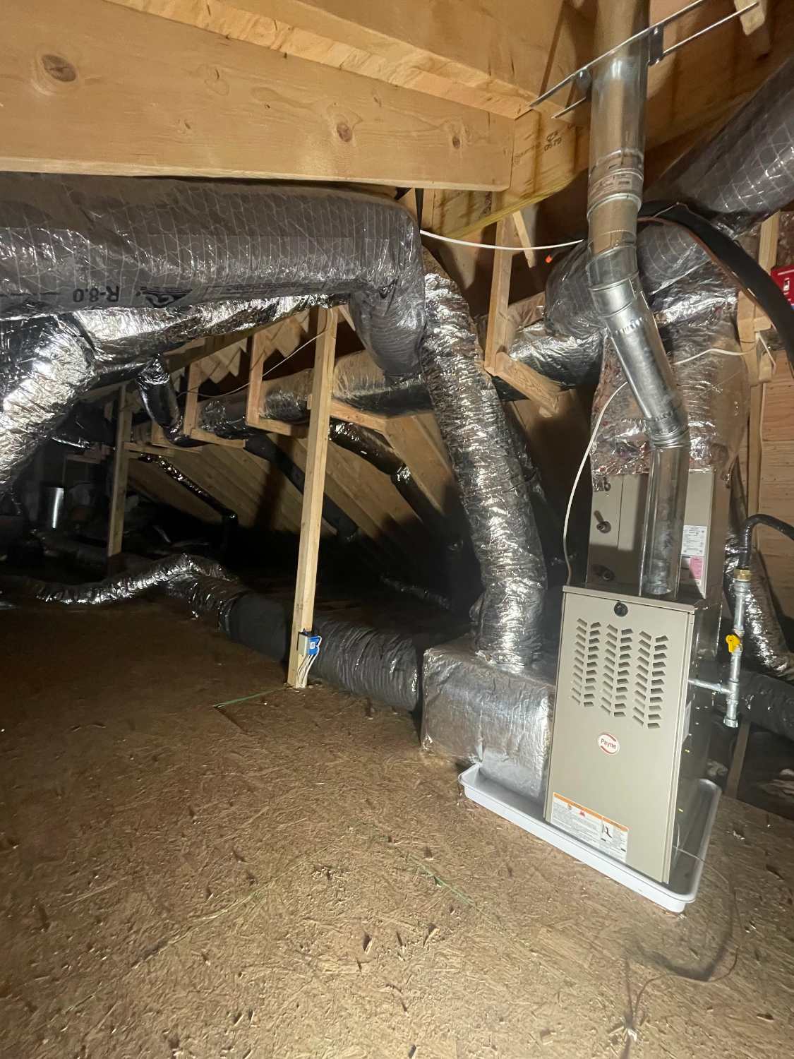 Attic air handler and new insulated ductwork installed by Comfort Pro