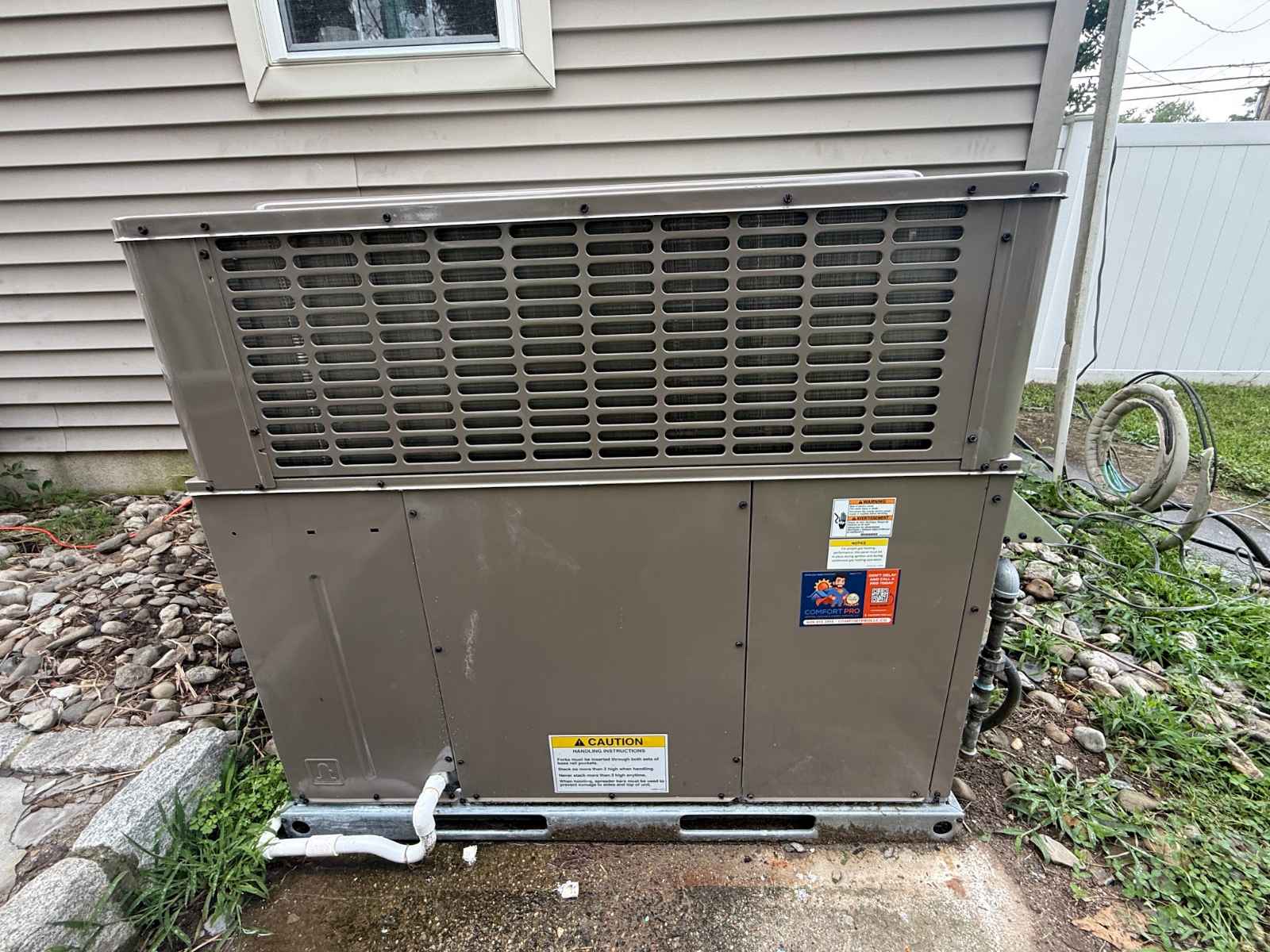 Rooftop packaged heating and cooling unit installed by Comfort Pro