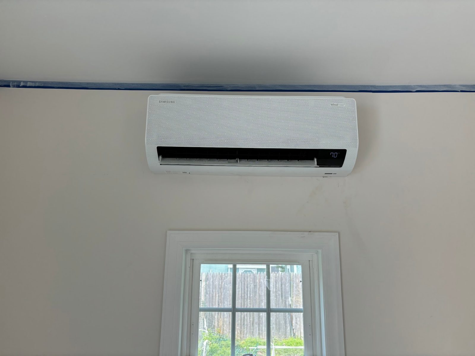 Ductless mini-split head installed on a bedroom wall by Comfort Pro