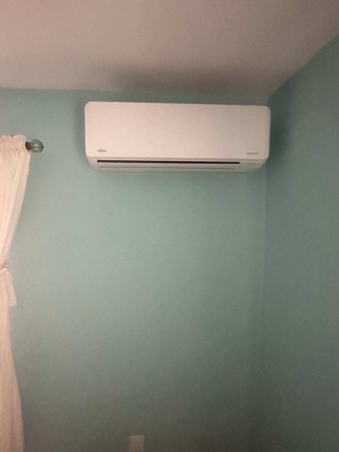 Ductless mini-split head mounted high on an interior wall in a Sea Isle City NJ home
