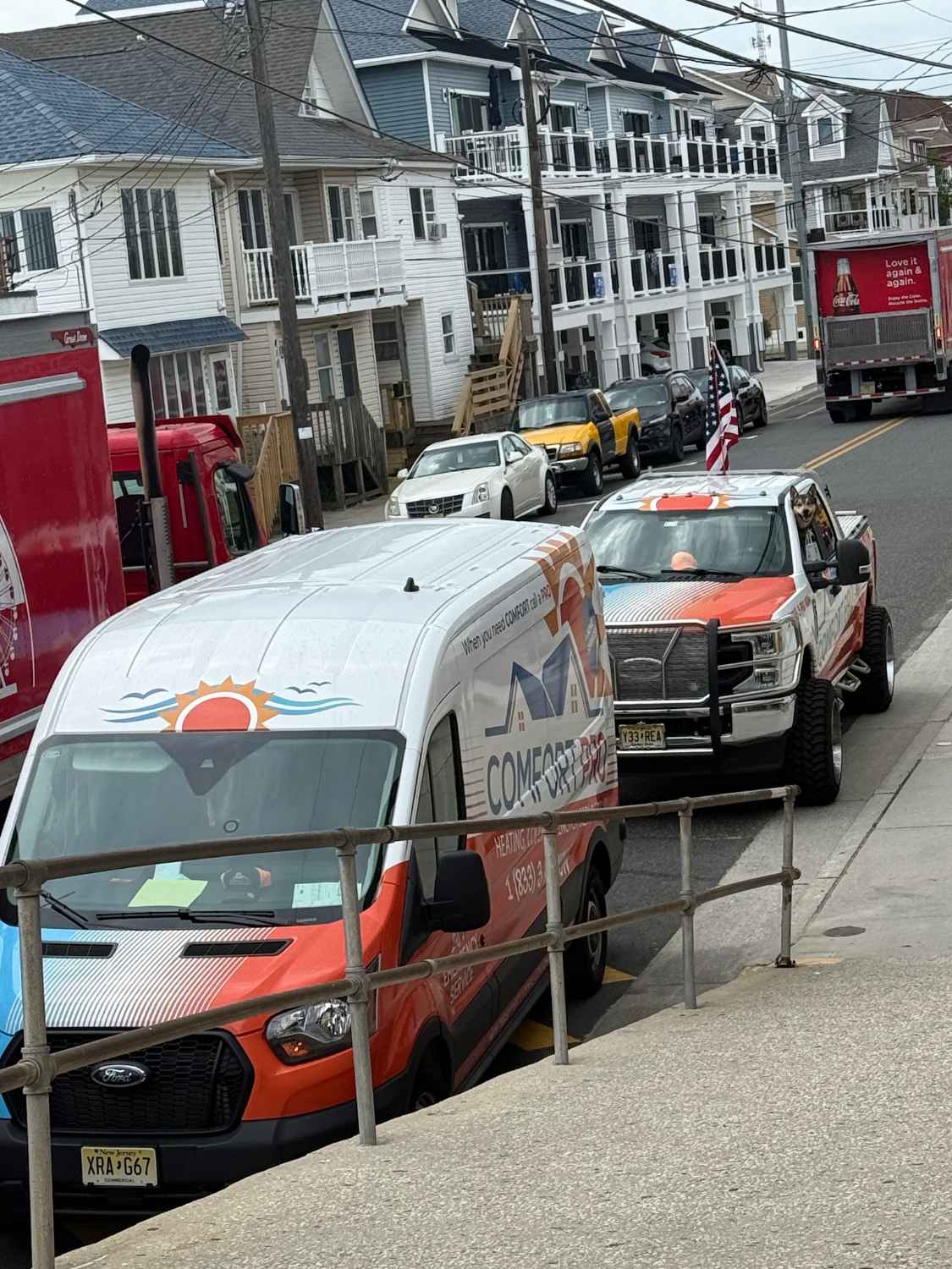 Comfort Pro vans and trucks lined up on a Cape May County street